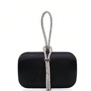 Woman’s black satin clutch with diamond band